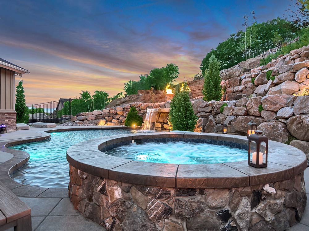 Rock terraced walls, rock water feature, stone hot tub, complete backyards